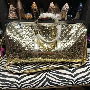 Glamaholic Metallic Monogram Duffle Bag